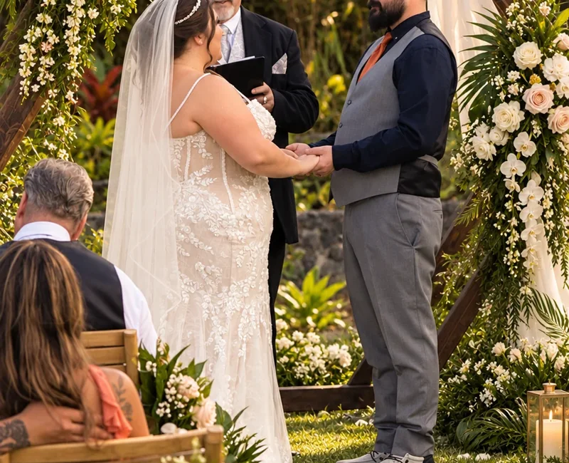 Couple exchanging vows during a Koa’s lawn ceremony