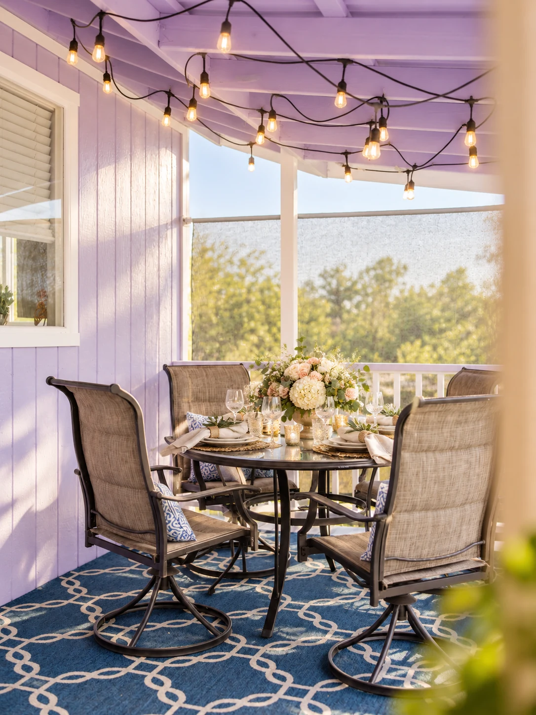 Covered cottage porch arranged for an intimate event dining setup