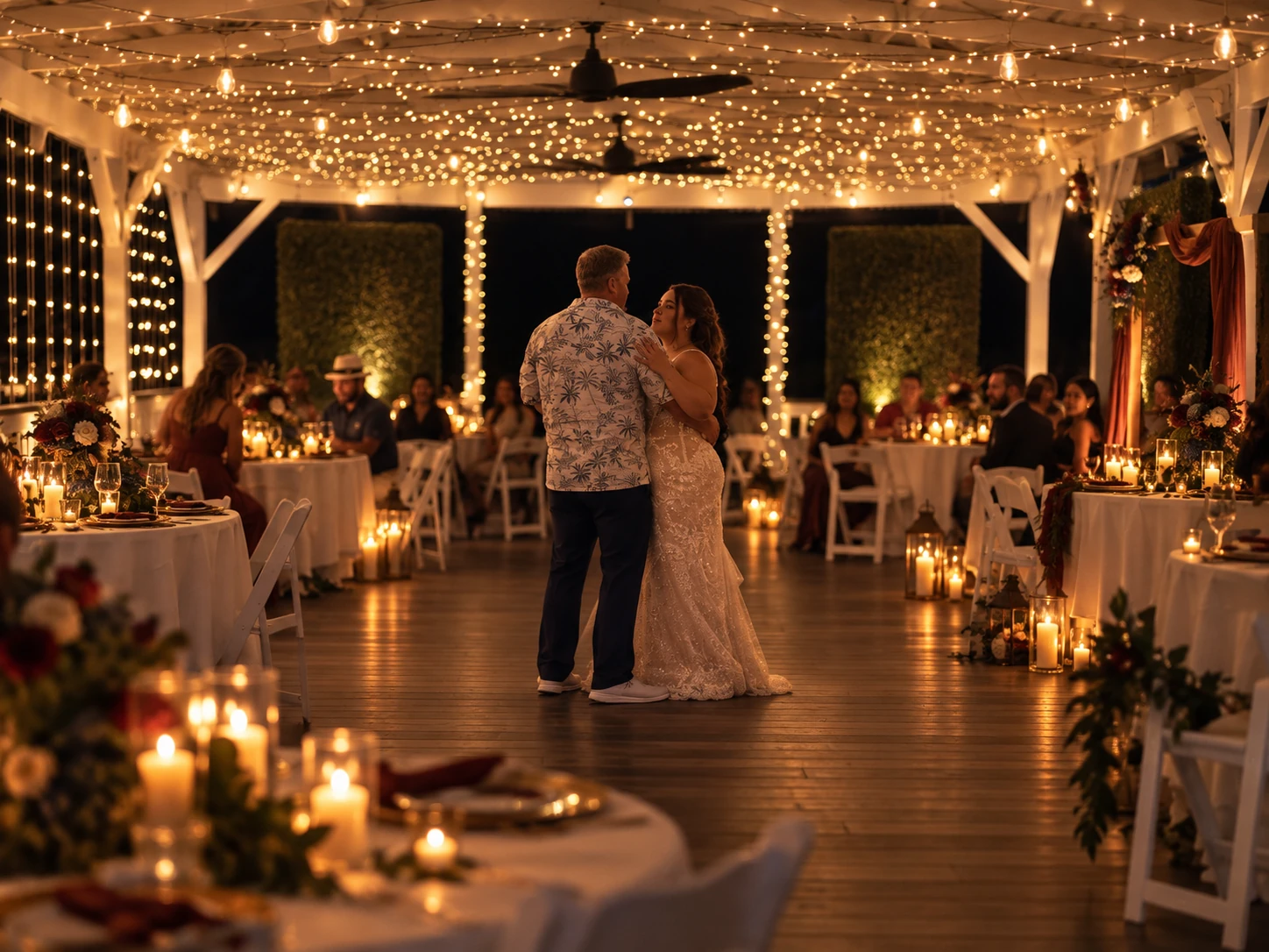 Reception tables beneath warm pavilion lights